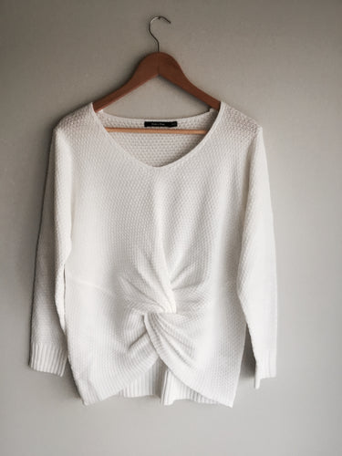 A twist on your average white sweater